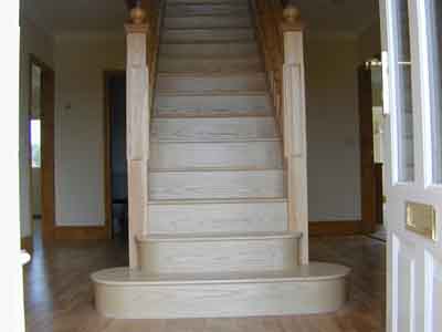 Hardwwod flight of stairs with a bottom bullnose tread