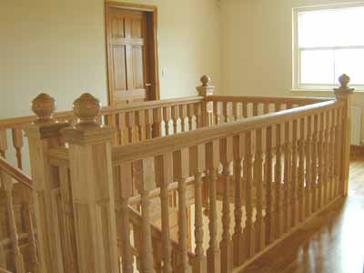 Panelled newel posts on hardwood stairs